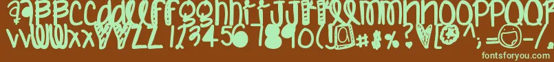 フォントHumannature – 緑色の文字が茶色の背景にあります。