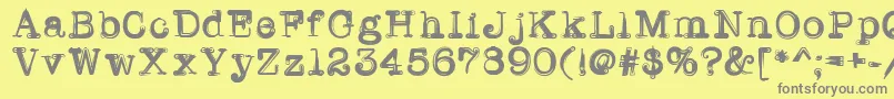Fonte Writerline – fontes cinzas em um fundo amarelo