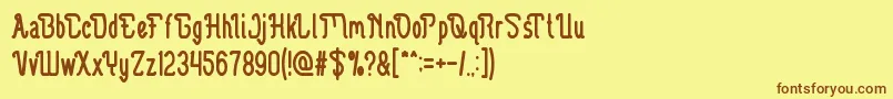 フォントGuitarElectric – 茶色の文字が黄色の背景にあります。