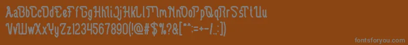 フォントGuitarElectric – 茶色の背景に灰色の文字