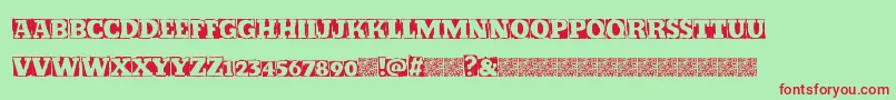 Kickstop-Schriftart – Rote Schriften auf grünem Hintergrund