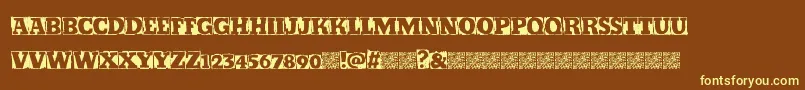Kickstop-Schriftart – Gelbe Schriften auf braunem Hintergrund