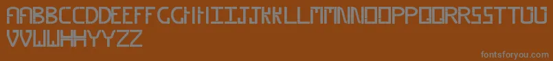 Weitere Informationen zur Piped-Schriftart Piped-Schriftart – Graue Schriften auf braunem Hintergrund