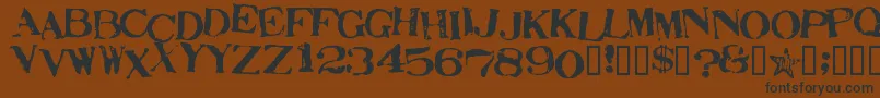 フォントStampActJumbled – 黒い文字が茶色の背景にあります