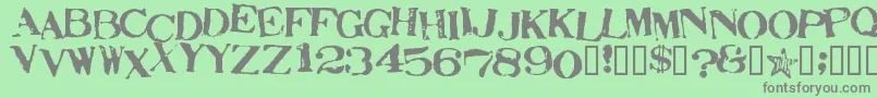 StampActJumbled-Schriftart – Graue Schriften auf grünem Hintergrund