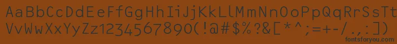 フォントOcrfLightosfc – 黒い文字が茶色の背景にあります