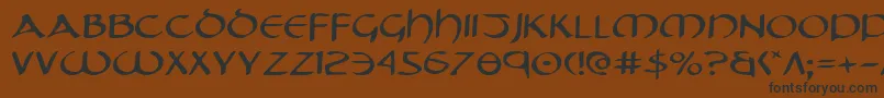 フォントTristrame – 黒い文字が茶色の背景にあります