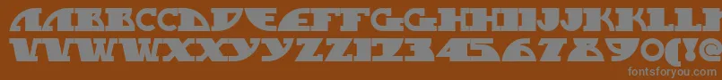 Mygasn-fontti – harmaat kirjasimet ruskealla taustalla