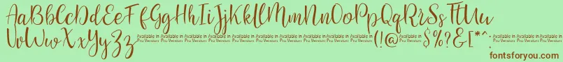 SaniesScript-Schriftart – Braune Schriften auf grünem Hintergrund