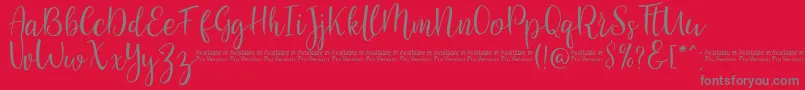 Fonte SaniesScript – fontes cinzas em um fundo vermelho