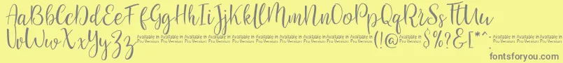 SaniesScript-Schriftart – Graue Schriften auf gelbem Hintergrund