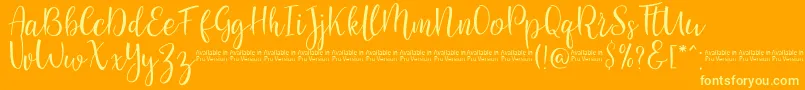 Fonte SaniesScript – fontes amarelas em um fundo laranja