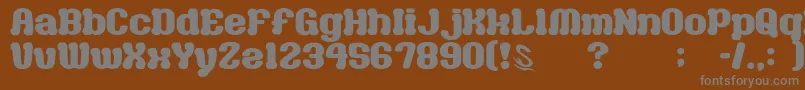 GomariceMilkChocolate-fontti – harmaat kirjasimet ruskealla taustalla