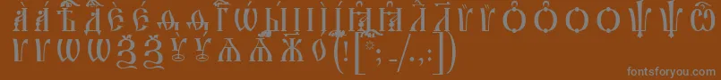 フォントIrmologionCapsUcsSpacedout – 茶色の背景に灰色の文字