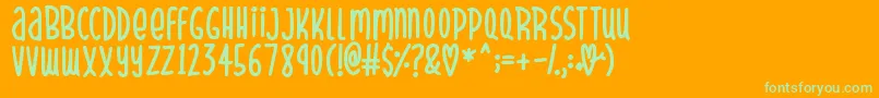 SparklyHearts-Schriftart – Grüne Schriften auf orangefarbenem Hintergrund