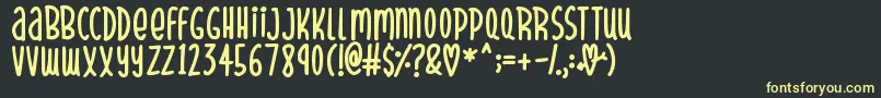 More about SparklyHearts Font SparklyHearts Font – Yellow Fonts on Black Background