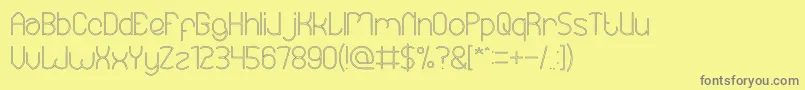 EssentialArrangementHollow Font – Gray Fonts on Yellow Background