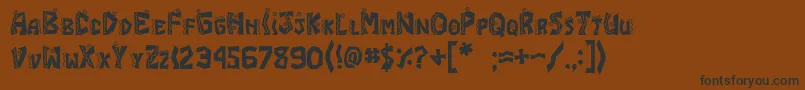 フォントJiChimichanga – 黒い文字が茶色の背景にあります