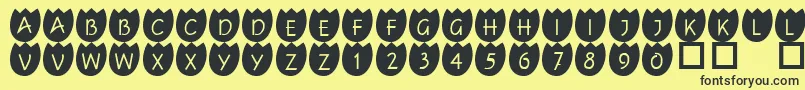 フォント101Tulipz – 黒い文字の黄色い背景