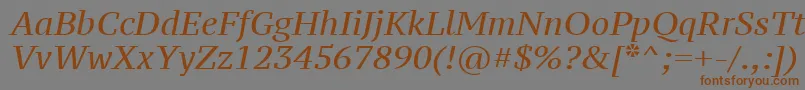 フォントPtz56fW – 茶色の文字が灰色の背景にあります。