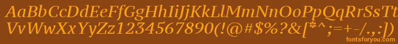 フォントPtz56fW – オレンジ色の文字が茶色の背景にあります。