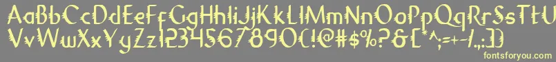 GypsyRoadCondensed-Schriftart – Gelbe Schriften auf grauem Hintergrund