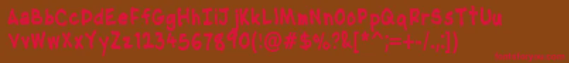 Fonte NipcensHandwritingCondbd – fontes vermelhas em um fundo marrom