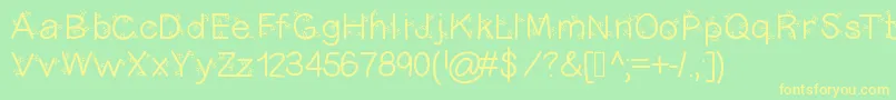 Christmasligtness Font – Yellow Fonts on Green Background