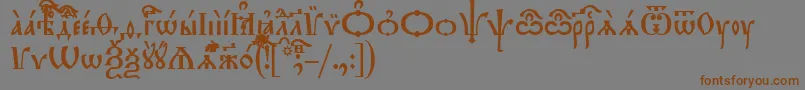 フォントTriodionIeucs – 茶色の文字が灰色の背景にあります。