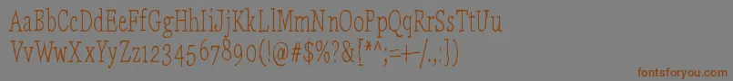 フォントLaikaComeHome – 茶色の文字が灰色の背景にあります。