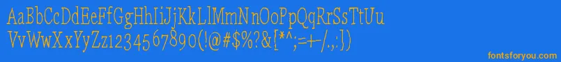 フォントLaikaComeHome – オレンジ色の文字が青い背景にあります。