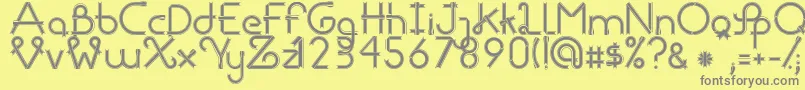 RibbonsRegular-fontti – harmaat kirjasimet keltaisella taustalla