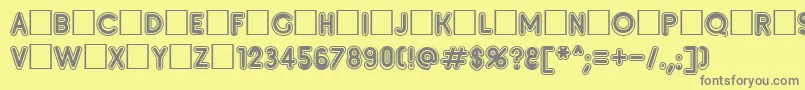 フォントInsete – 黄色の背景に灰色の文字