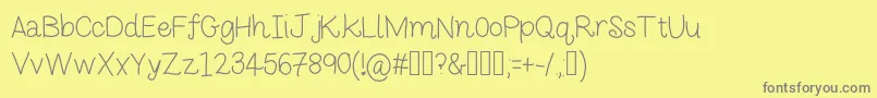 Monkeybutt2-Schriftart – Graue Schriften auf gelbem Hintergrund