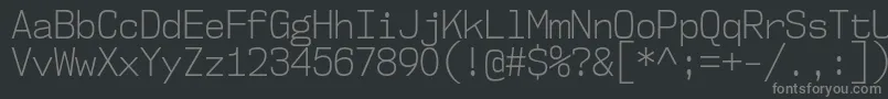 Nk57MonospaceScLt-fontti – harmaat kirjasimet mustalla taustalla