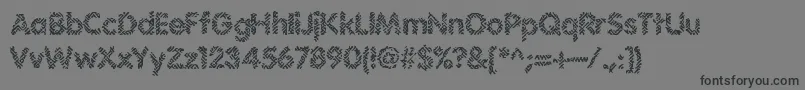Irritate-Schriftart – Schwarze Schriften auf grauem Hintergrund