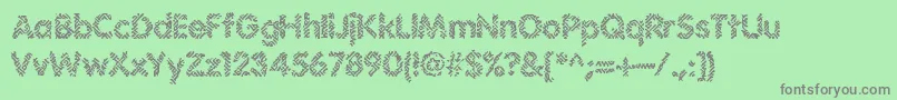 フォントIrritate – 緑の背景に灰色の文字