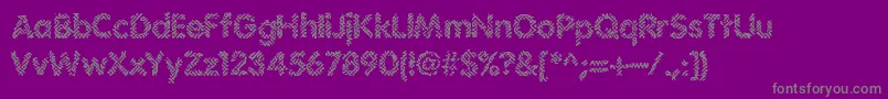 Irritate-Schriftart – Graue Schriften auf violettem Hintergrund