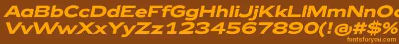 フォントZeppelin42BoldItalic – オレンジ色の文字が茶色の背景にあります。