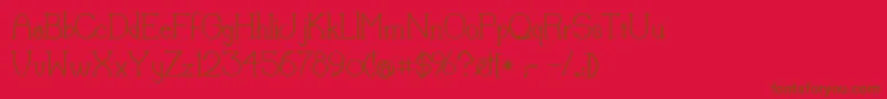LorenaMedium-Schriftart – Braune Schriften auf rotem Hintergrund