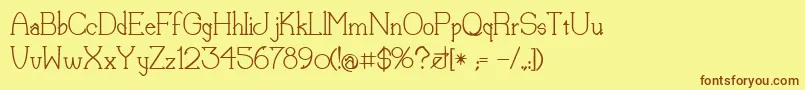 フォントLorenaMedium – 茶色の文字が黄色の背景にあります。