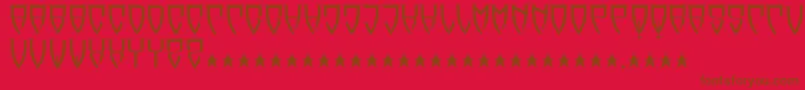 フォントReubalach – 赤い背景に茶色の文字