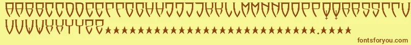 フォントReubalach – 茶色の文字が黄色の背景にあります。