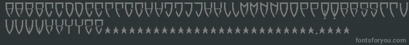 Reubalach-fontti – harmaat kirjasimet mustalla taustalla
