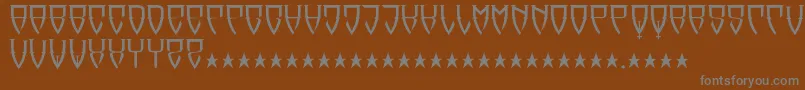 Reubalach-fontti – harmaat kirjasimet ruskealla taustalla