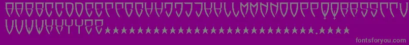 Reubalach-fontti – harmaat kirjasimet violetilla taustalla