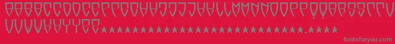フォントReubalach – 赤い背景に灰色の文字