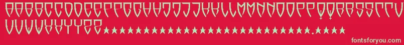 フォントReubalach – 赤い背景に緑の文字