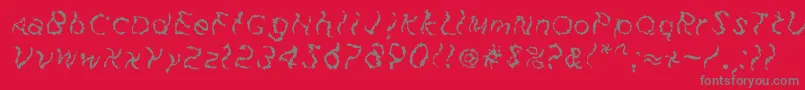 フォントFuzzfaceRegular – 赤い背景に灰色の文字