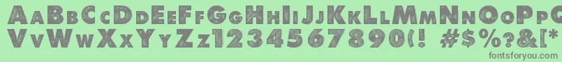 フォントDebeli – 緑の背景に灰色の文字